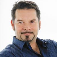 A headshot of Dr Floresco